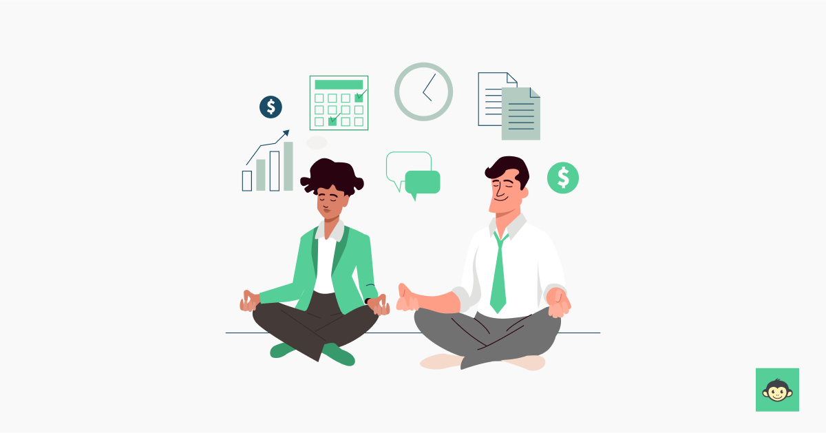 Two employees are meditating together