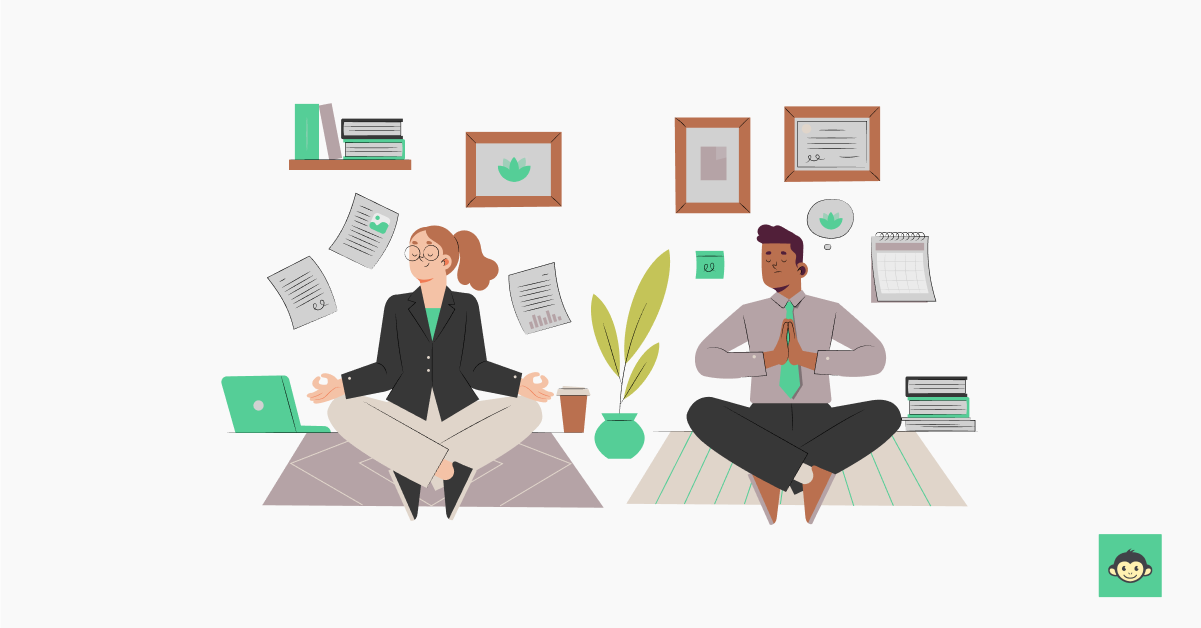 Two employees are meditating in the workplace