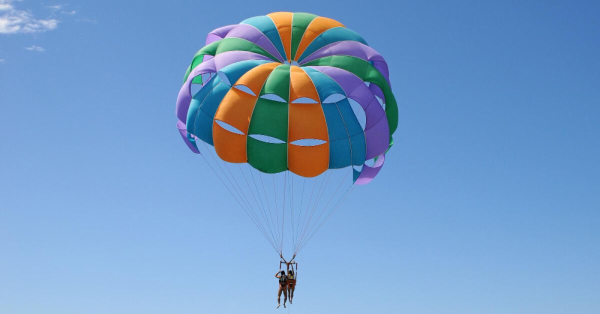 Two people parasailing