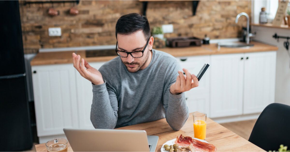 A man eating his lunch while working