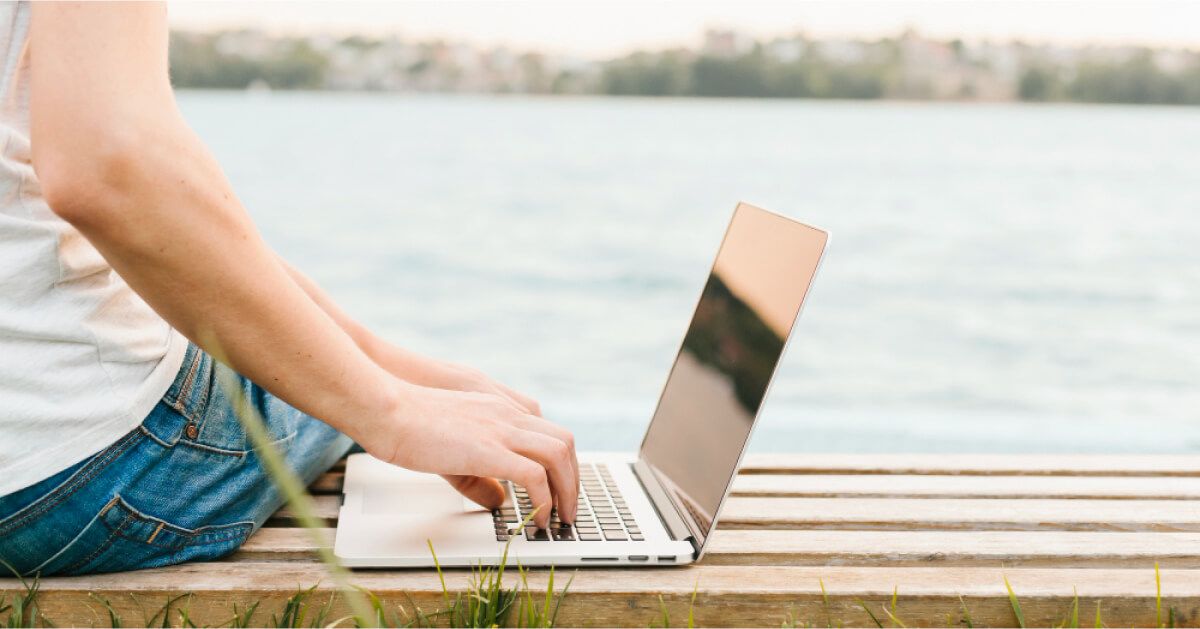 Employee working with a river side view