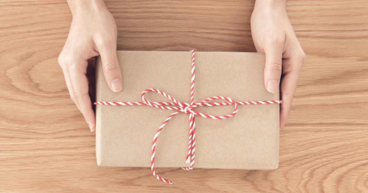 A women holding a wrapped gift