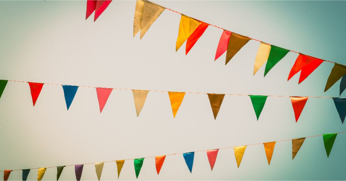 Multi-color flags hanging above the ground