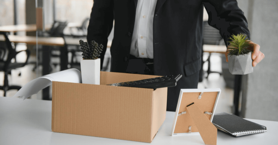 Employee clearing his desk and packing his things