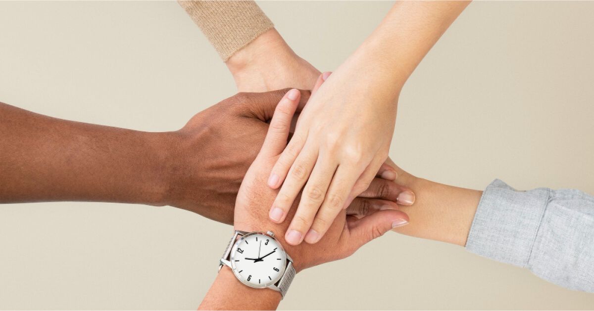 Hands of people stacked on each other