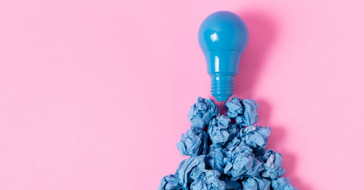 A blue light bulb on mashed papers