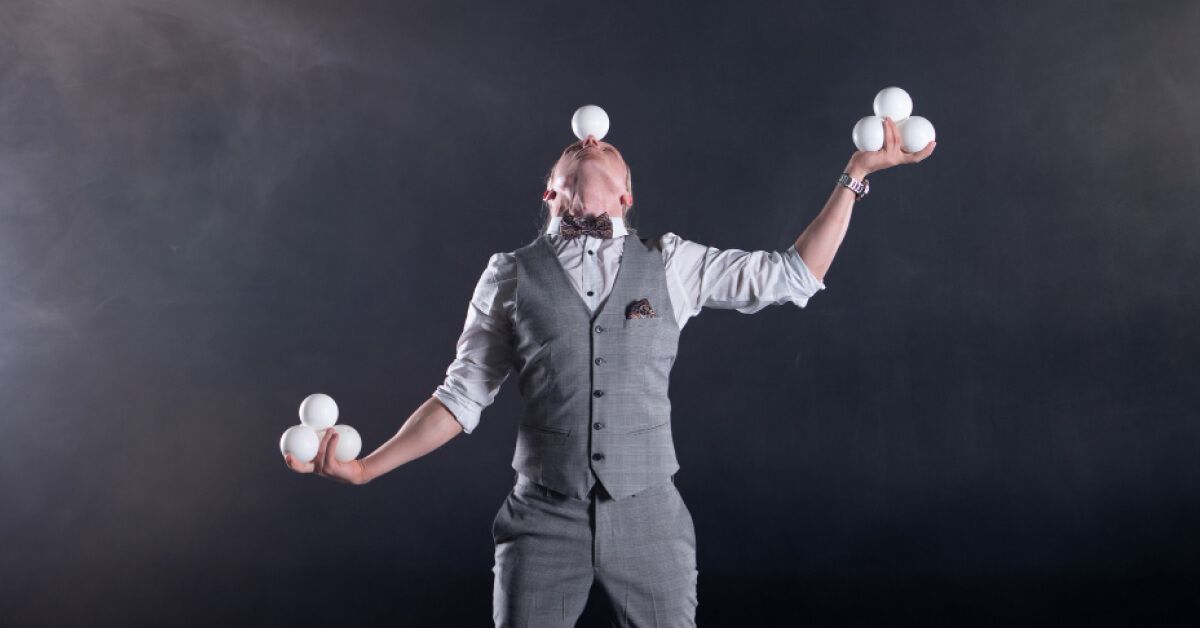 A person juggling balls with his hands 