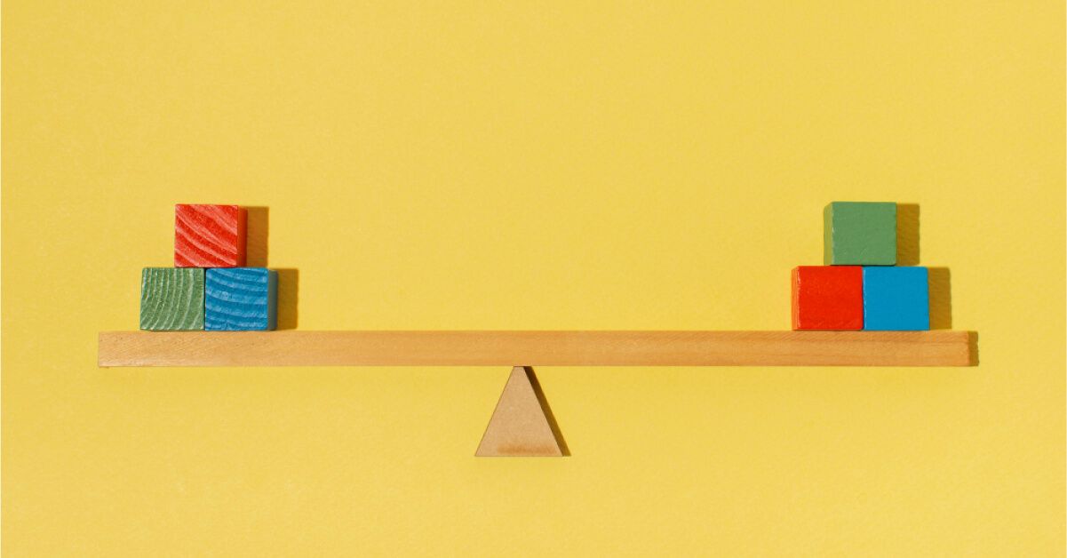 Wooden blocks on a balance scale 