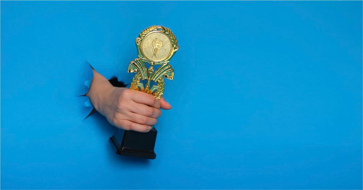 A man holding an award