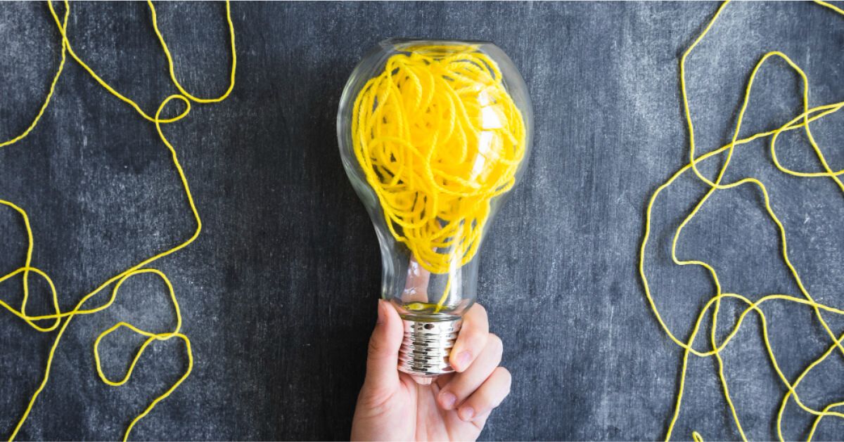 A man holding a light bulb