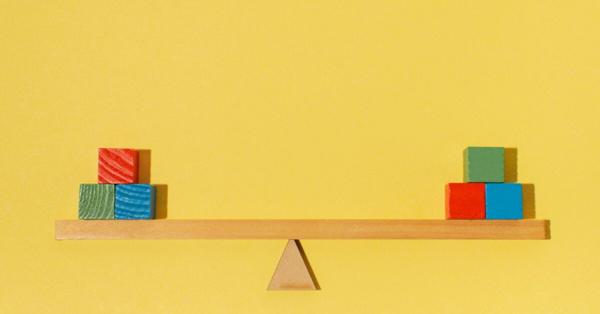 Blocks on a wooden balance