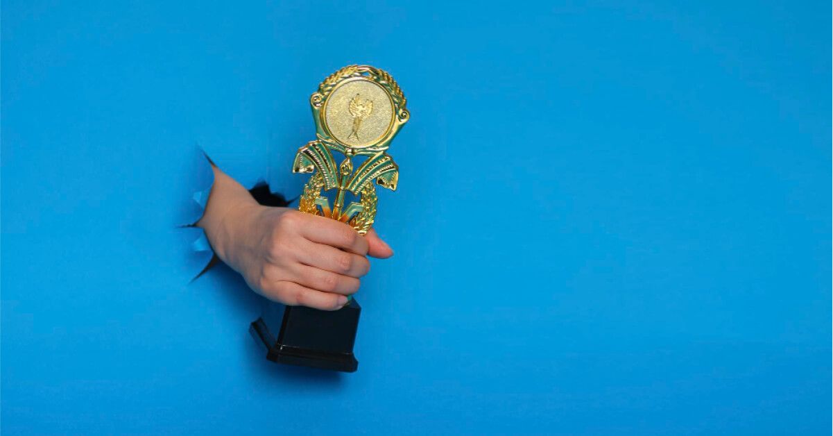 A man holding an award