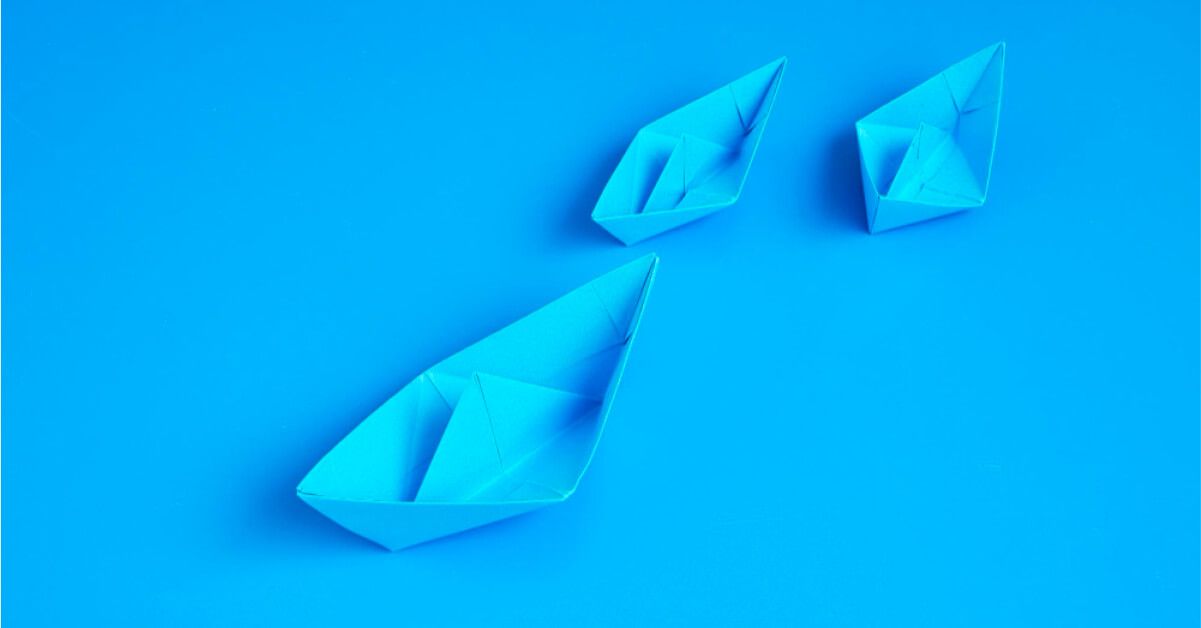 Three blue paper boats