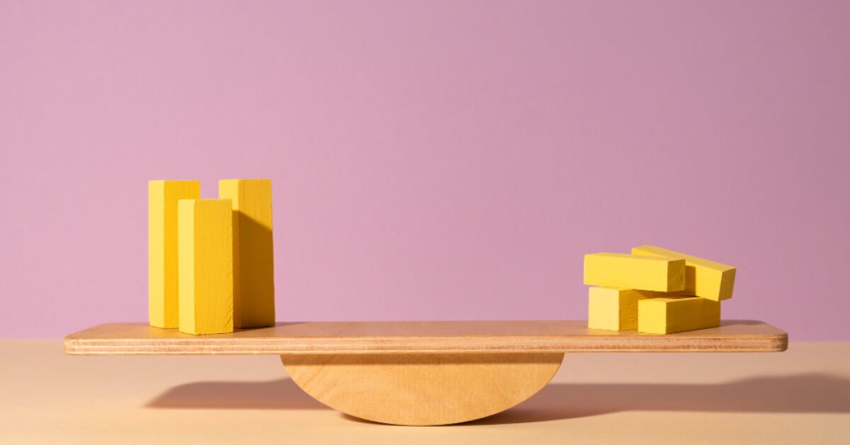 Wooden blocks on a balance scale 