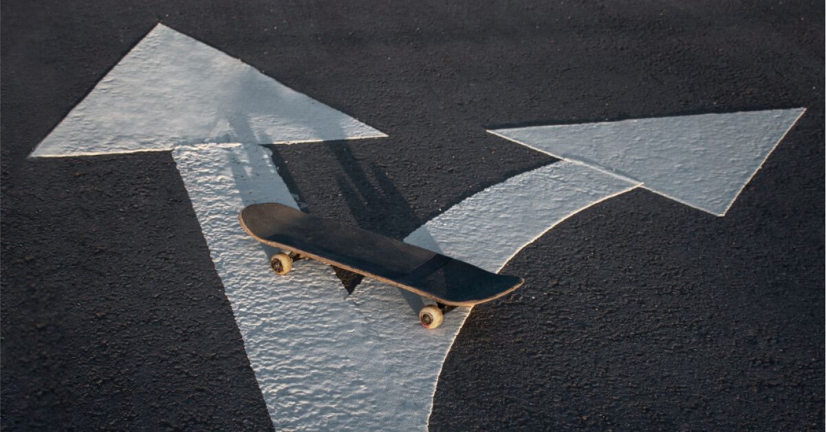 A skateboard in the middle of the road