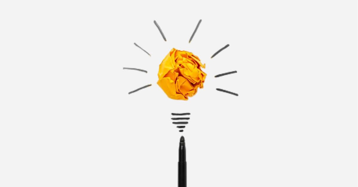 A crushed yellow paper in a light bulb design