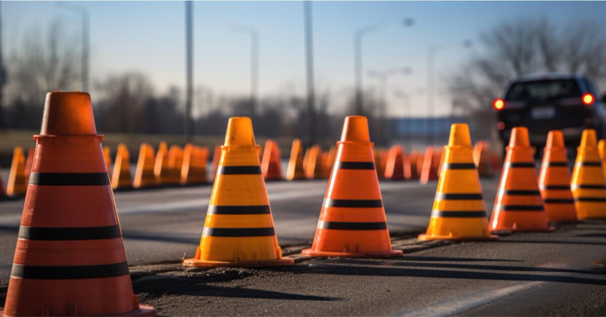 Car travelling between traffic cones 