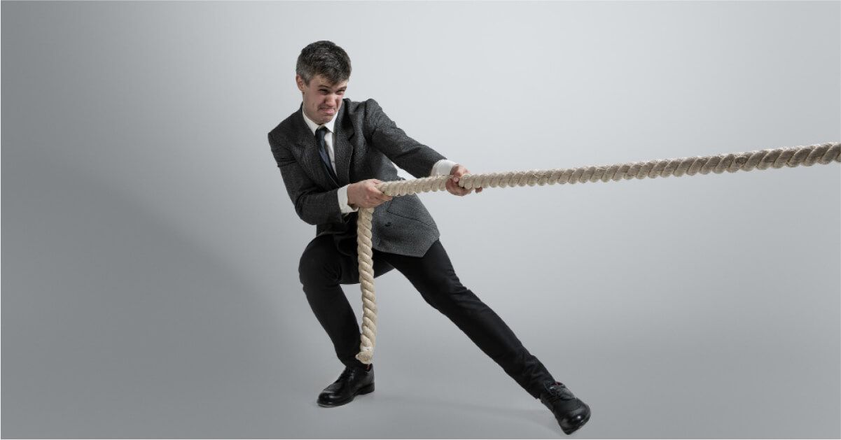 A man holding onto the end of a rope