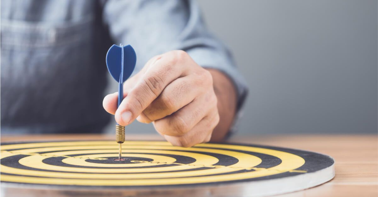 A man playing darts