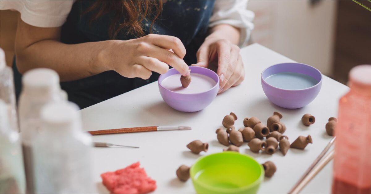 A woman doing miniature pottery