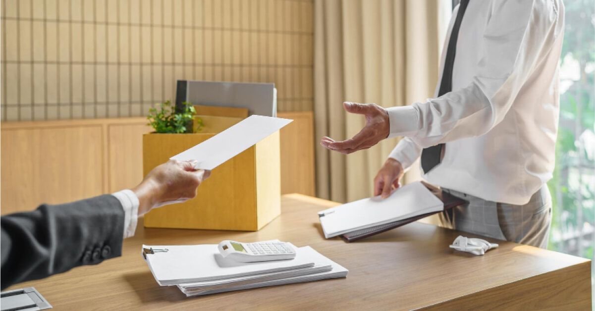 Employee handing notice paper to the employer