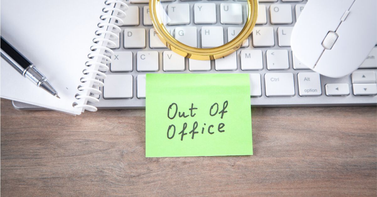 An out of office post it note