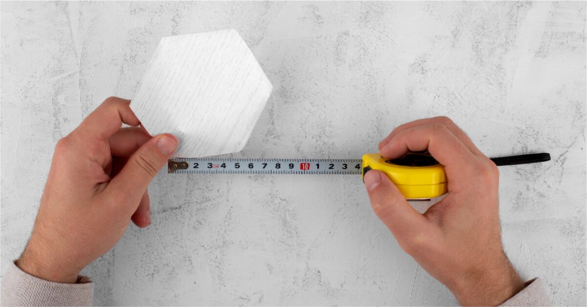 Hands measuring with measuring tape