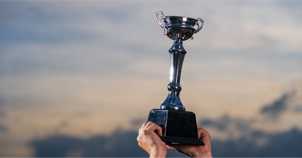 A man holding an award