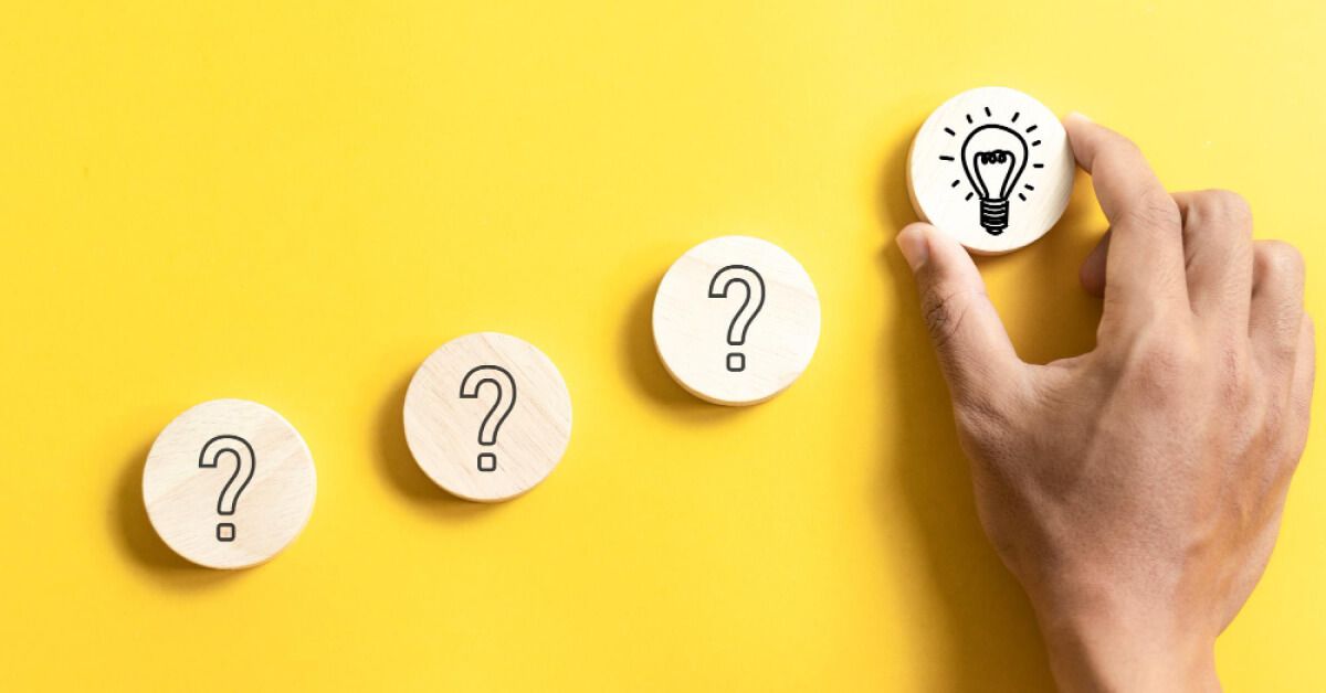 Round wooden blocks with question marks and bulb signs 