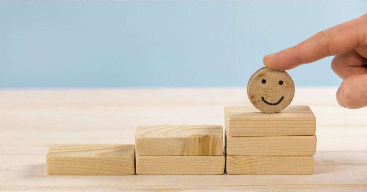 A smiley emoji on wooden blocks