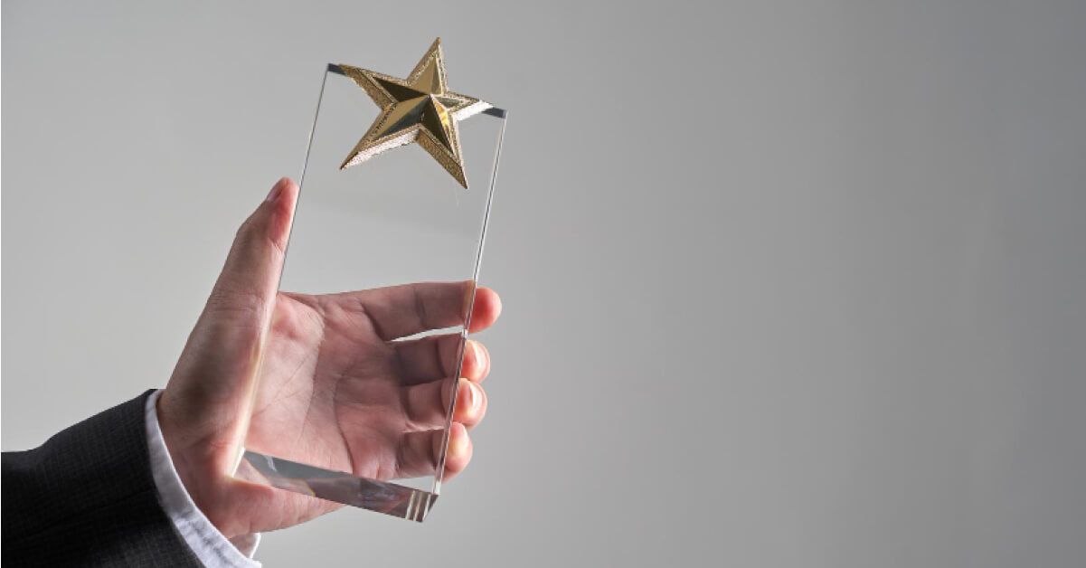 A man holding an award