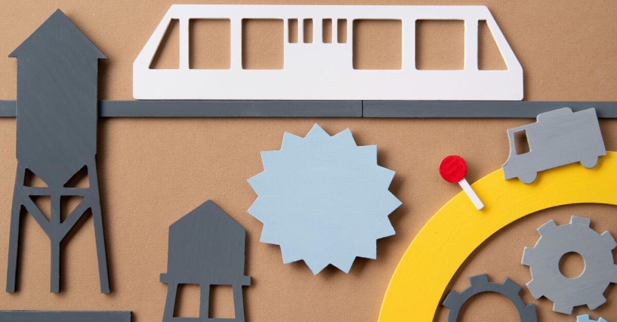 Paper cutouts of gears, towers & industrial symbols