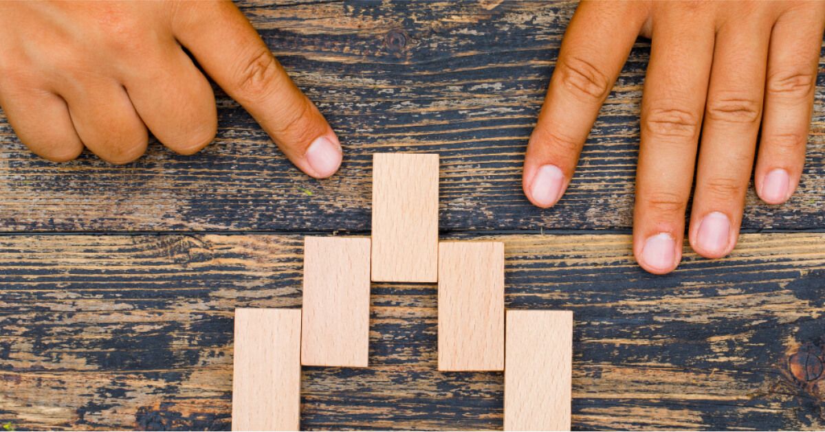 Two hands choosing rectangular wooden box