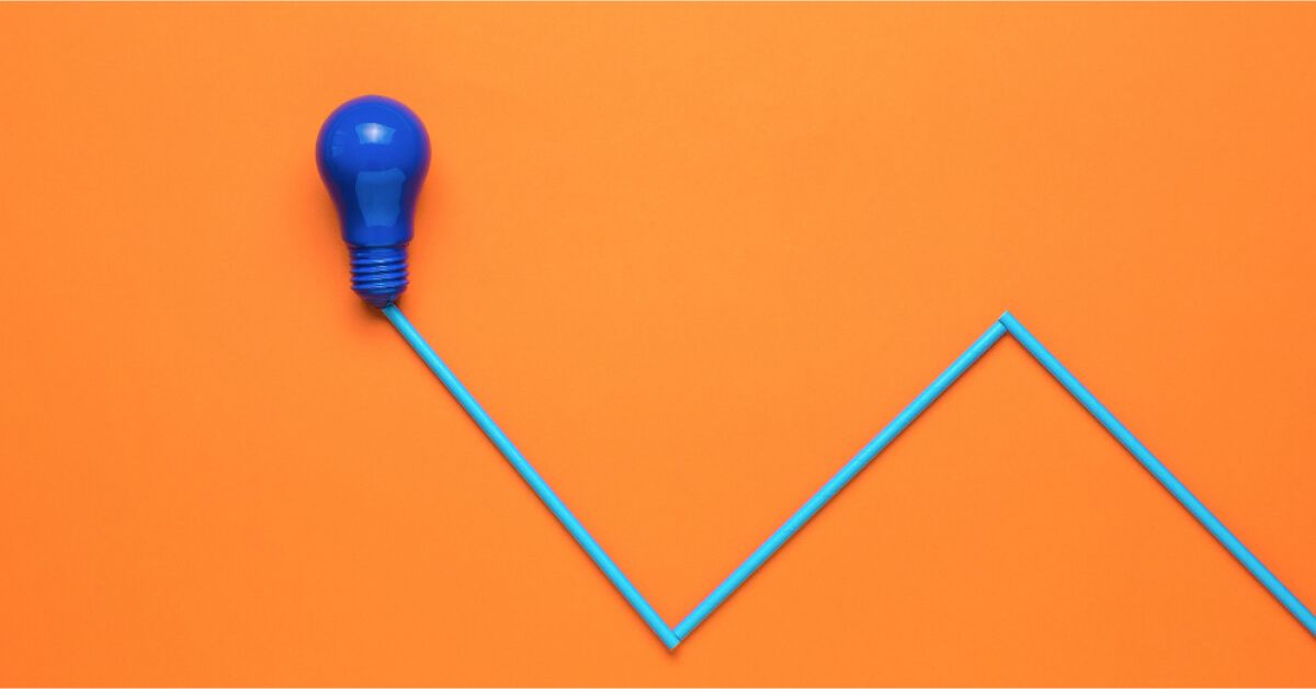 Purple bulb with blue straws, against a bright orange backdrop