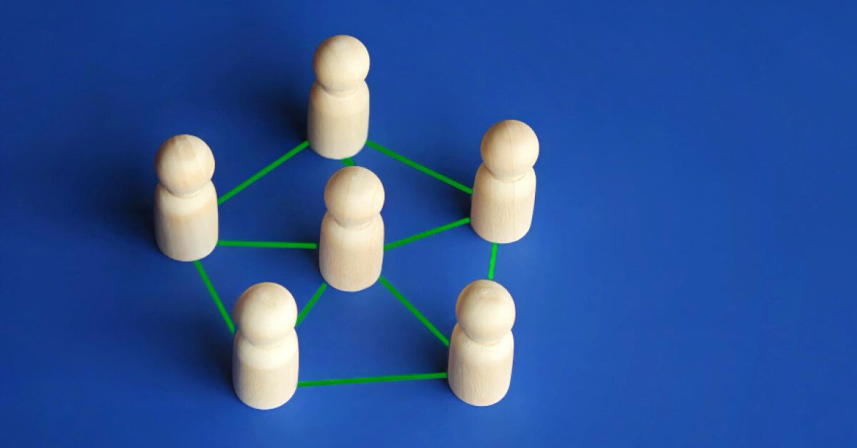 A group of interconnected pawns in blue background.