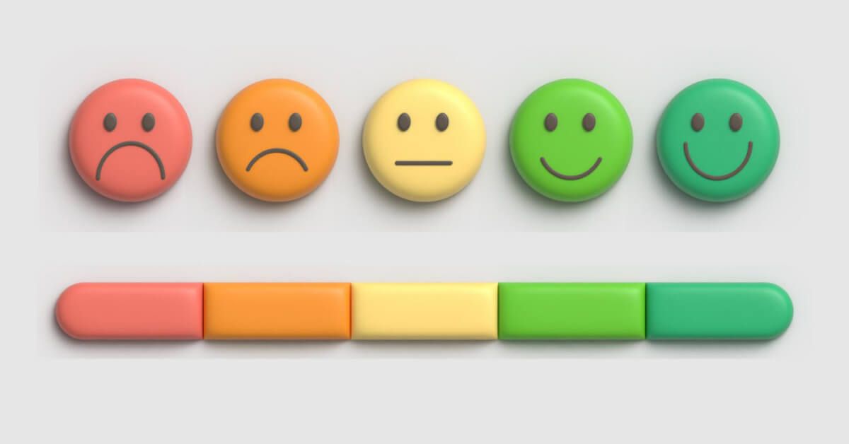 A scale of color coded emojis ranging from sad to happy