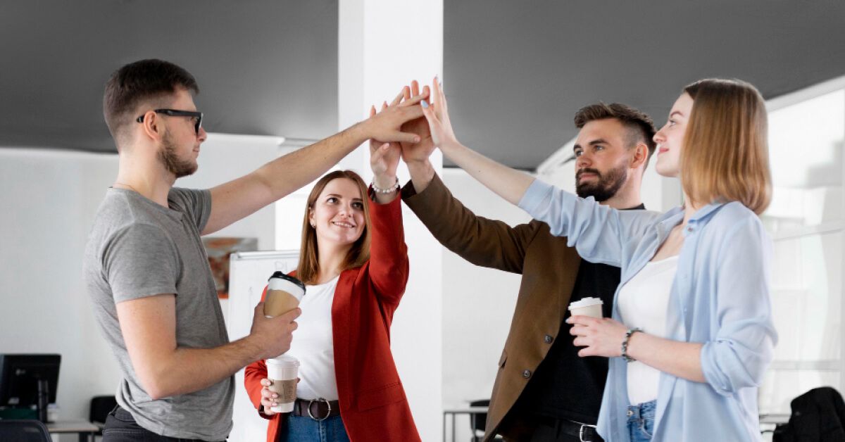 A team of people participating in a group cheer