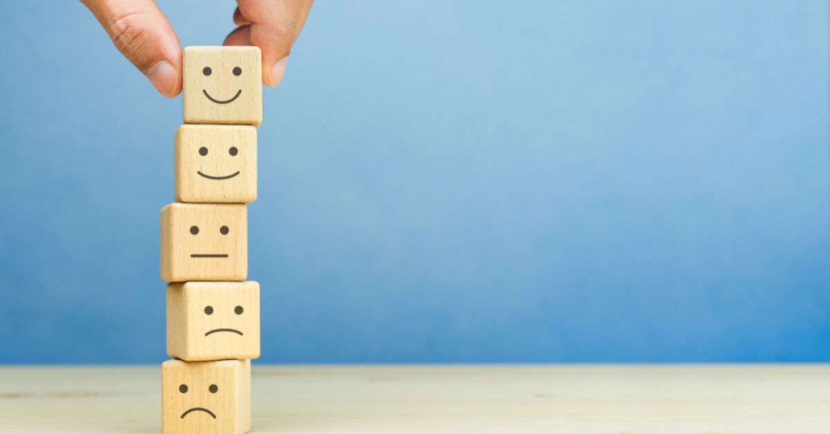 A stack of wooden blocks with reactions on them