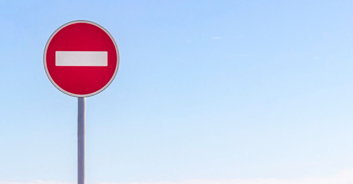 Red stop sign against a blue sky