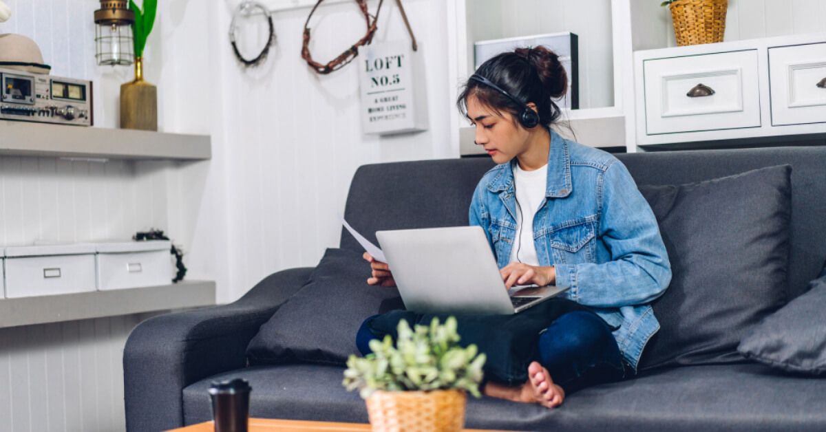 A happy and relaxed women enjoying using laptop