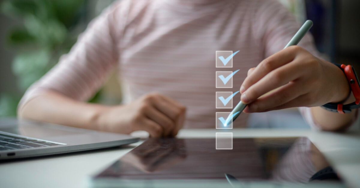 Person checking a box on a holographic checklist