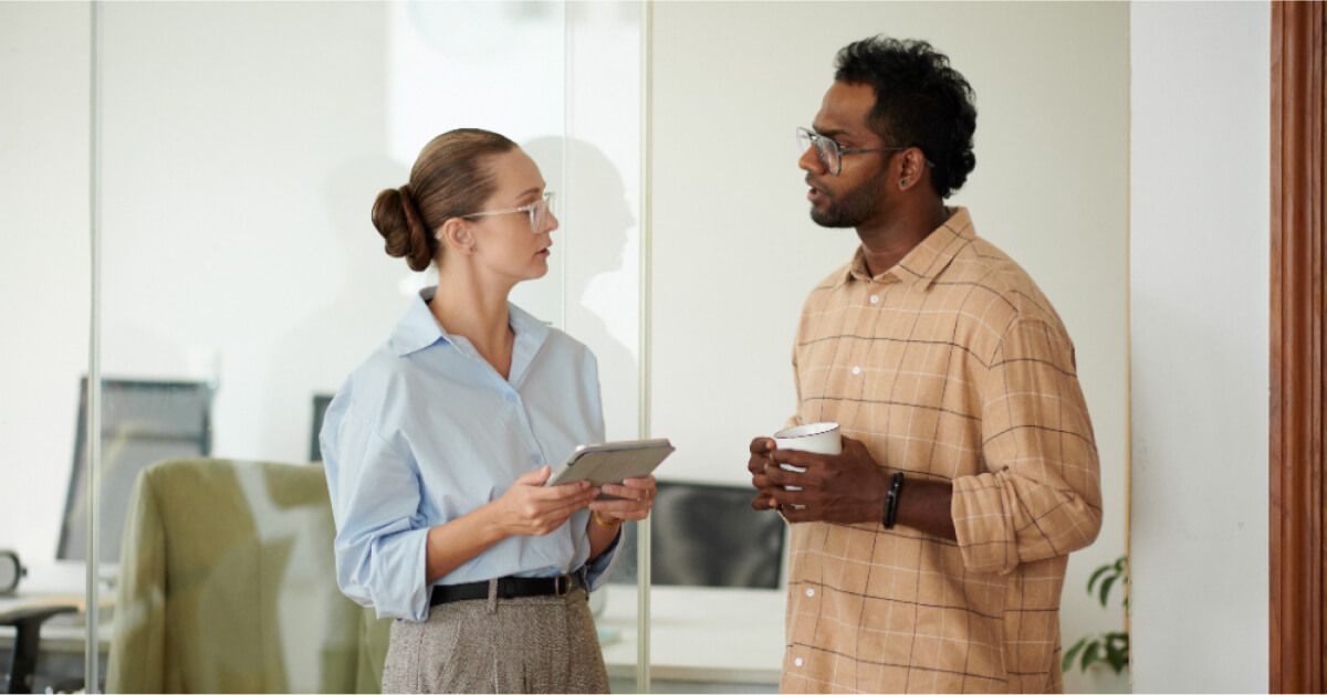 Two people discussing in an office setting