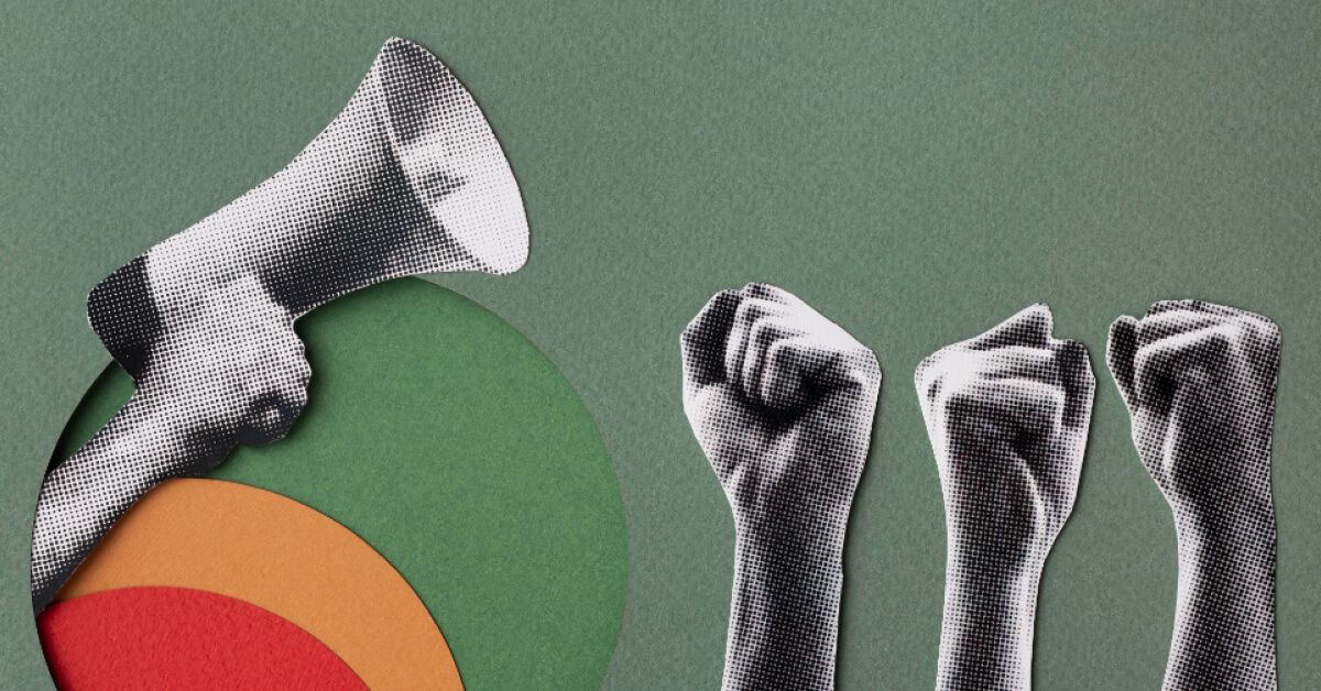 Raised fists in support of a handheld loudspeaker