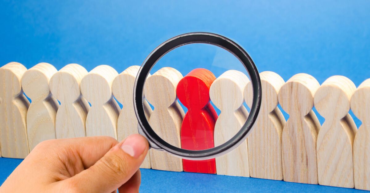 A person using a magnifying glass 