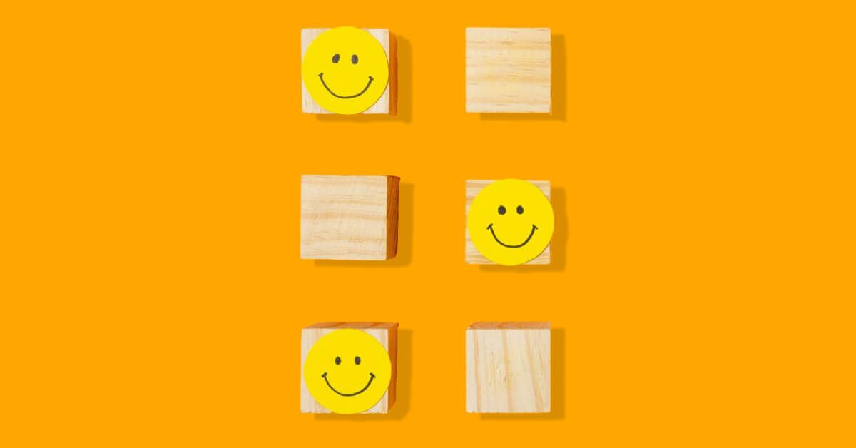 Yellow smiley faces over some blocks in a group of wooden blocks