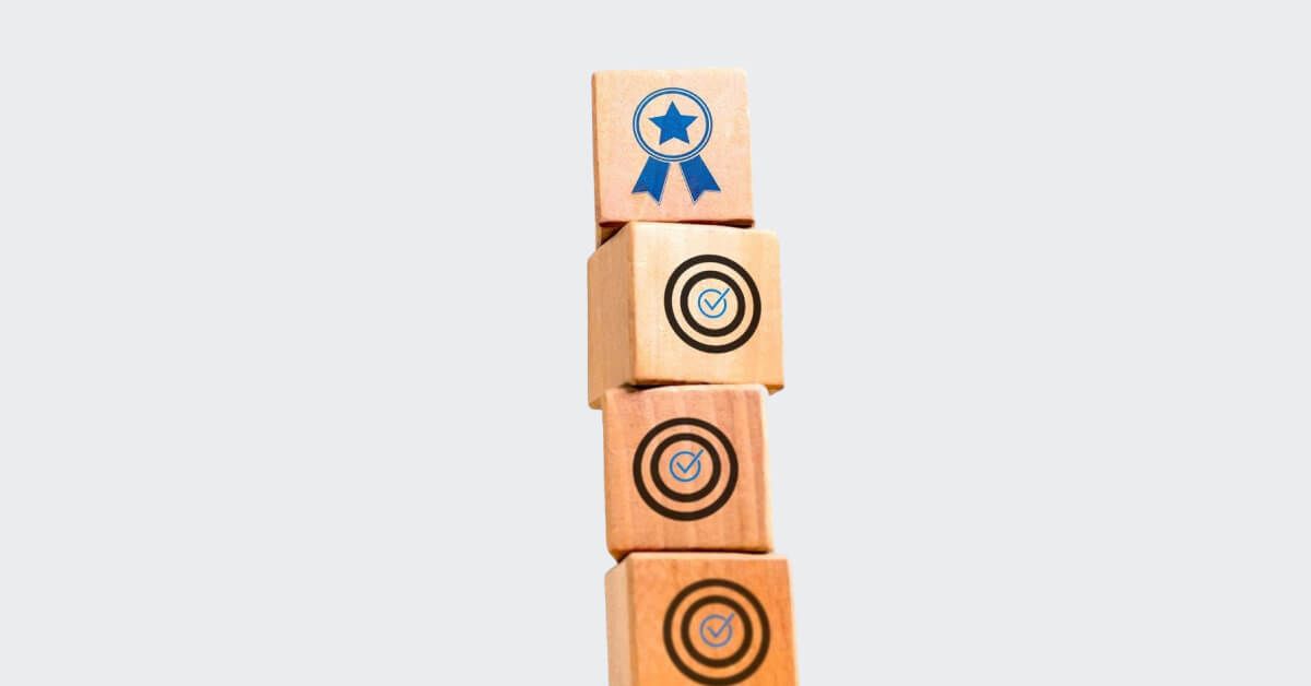 Wooden blocks with engraved icons, placed on top of each other