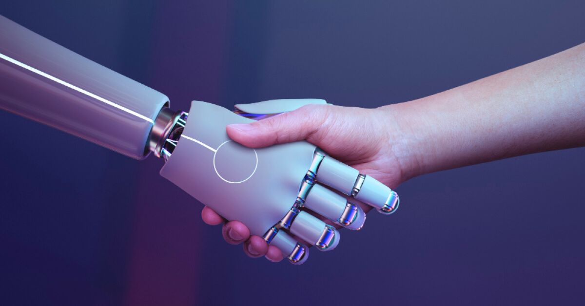 Human shaking hands with a robo