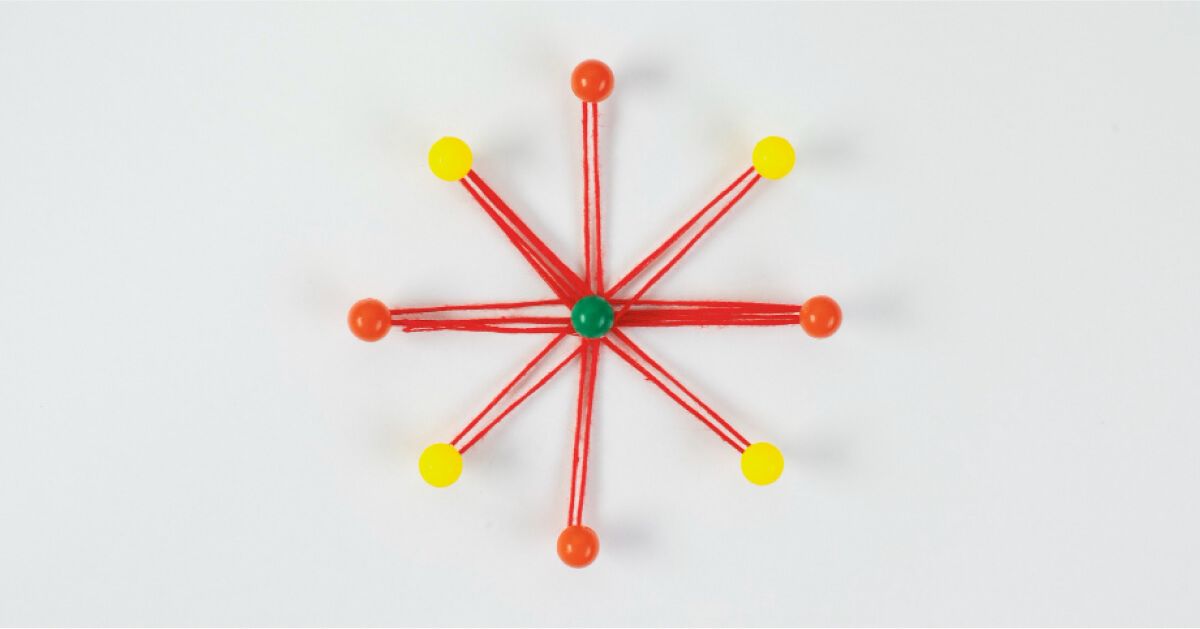 A red thread interconnected with yellow and red dots