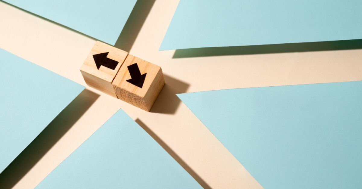 Wooden blocks pointing to different direction