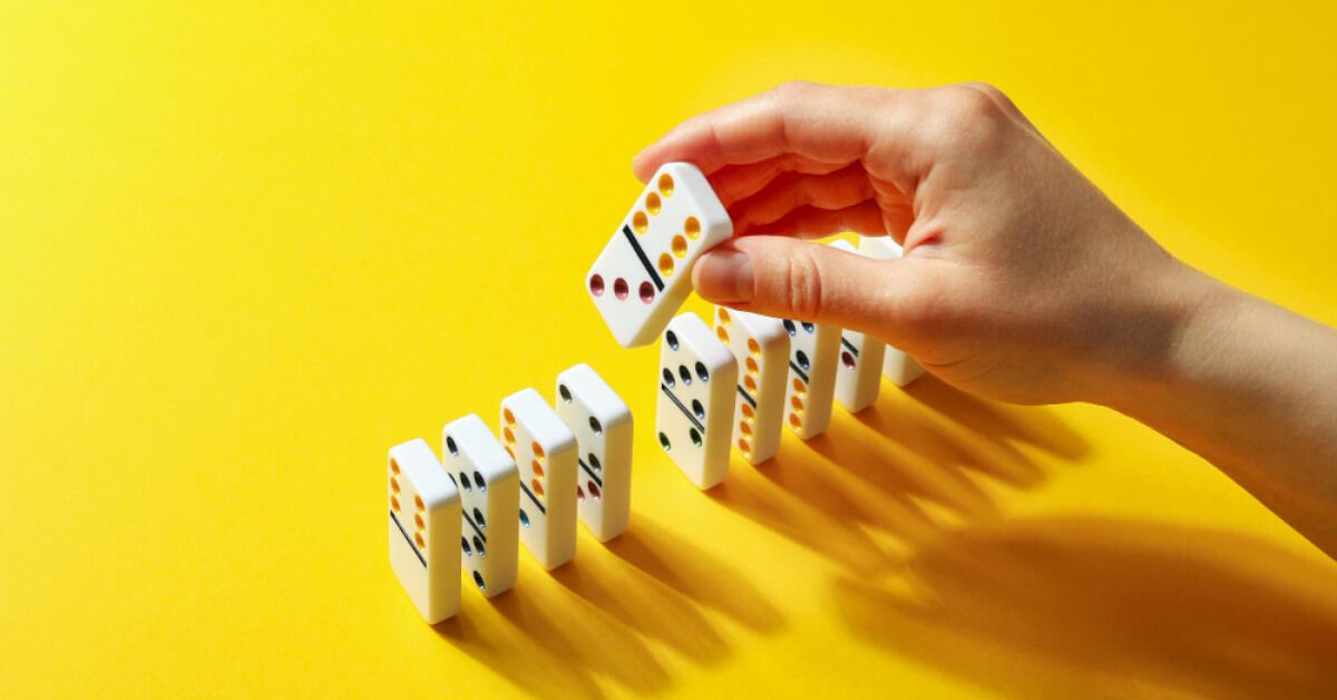 Person placing a checker into a series of checkers